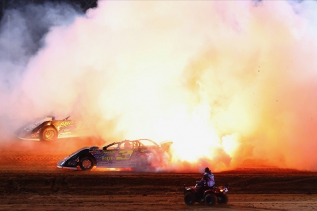 Brian Shirley rolls his burning car to the infield. (joshjamesartwork.com)