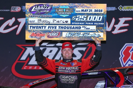 Bobby Pierce displays his $25,000 winner's check. (Josh James)