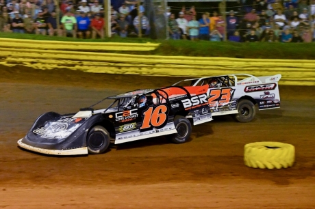 Sam Seawright (16) overtakes Cory Hedgecock (23v). (Zackary Washington)