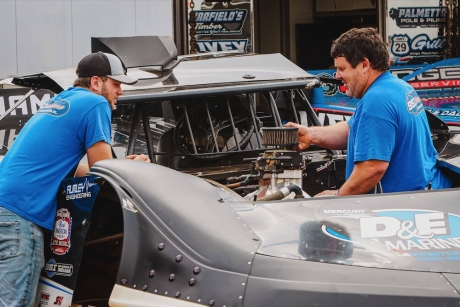 Hudson O'Neal (left) and Kevin Rumley in the Charlotte pits. (Zach Yost)