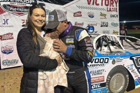 Moran kisses his newborn daughter Poppy Jane. (Kyle McFadden)