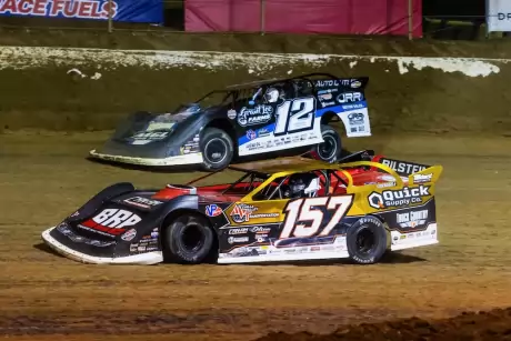 Mike Marlar (157) limps to the infield pits. (heathlawsonphotos.com)