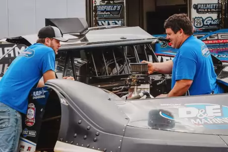 Hudson O'Neal (left) and Kevin Rumley in the Charlotte pits. (Zach Yost)