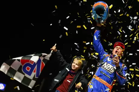 Nick Hoffman celebrates with his son at Volusia. (Josh James)
