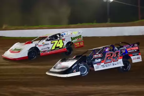 Ryan Unzicker (24) chases Ethan Dotson (74x) at Peoria. (joshjamesartwork.com)
