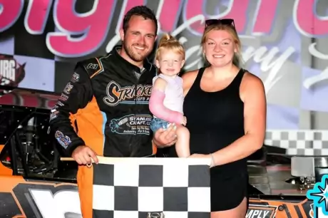 Adam Stricker with his family in victory lane. (Steve Alcorn)