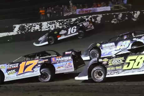 Sam Seawright (16) rolls around Fairbury's cushion. (joshjamesartwork.com)