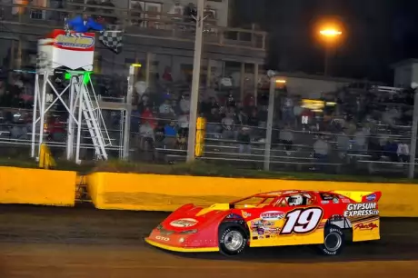 Tim Fuller takes the checkers. (thesportswire.net)