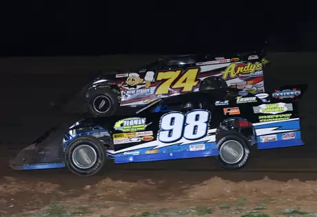 Justin Wells (98) moves past Jeremy Payne (74). (Ron Mitchell)