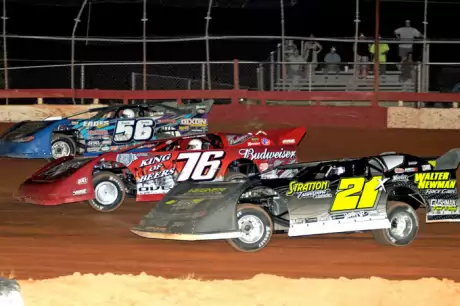 Brandon Overton (76) races three-wide en route to victory at Screven. (Carlson Race Photos)