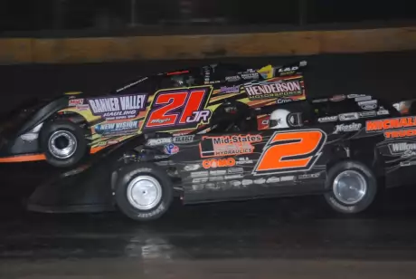 Billy Moyer Jr. (21jr) fights off Brady Smith (2) in turn two at Cedar Lake. (DirtonDirt.com)