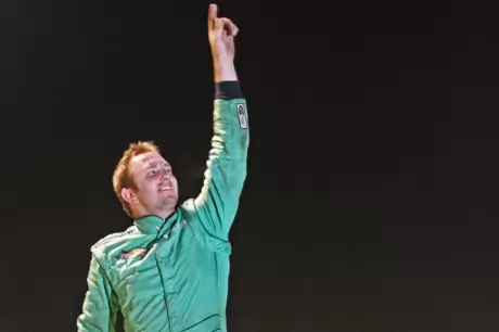 Walker Arthur climbed atop his car in victory lane. (Clifford Dove)