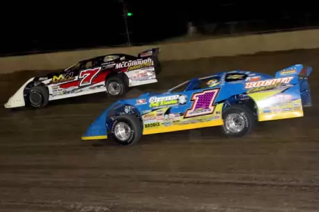 Josh Richards (1) sizes up Matt Miller (7). (Jim DenHamer)