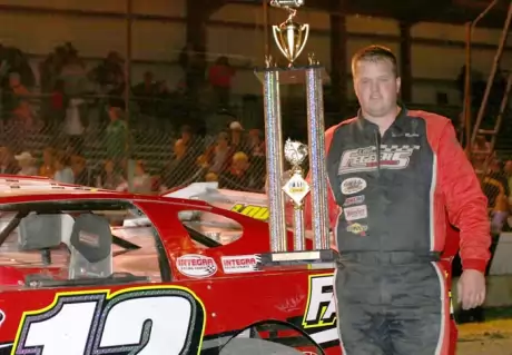 Chad Becker picks up his Jamestown hardware. (crpphotos.com)