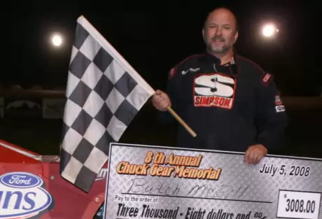 Butch McGill enjoys victory lane. (Bob Reed)